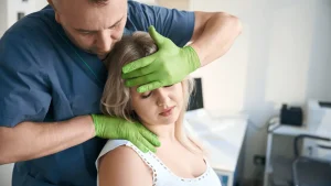 Chiropractor providing spinal adjustment for a car accident patient.