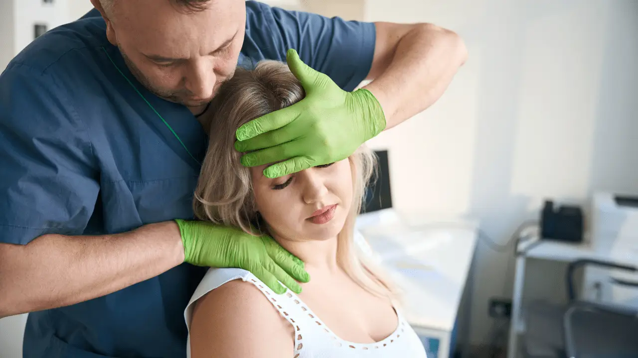 Chiropractor providing spinal adjustment for a car accident patient.