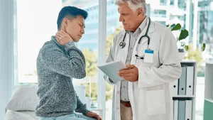 San Antonio car accident doctor evaluating a patient after a minor collision.