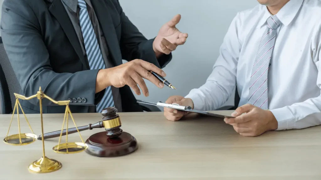 Car accident lawyer consulting with injured client in Houston office.