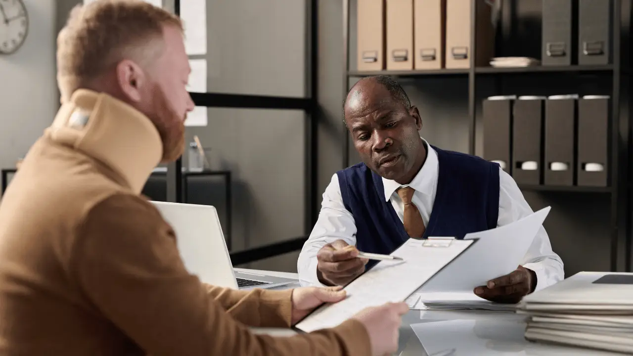 Car accident attorney in Houston discussing a case with a client.