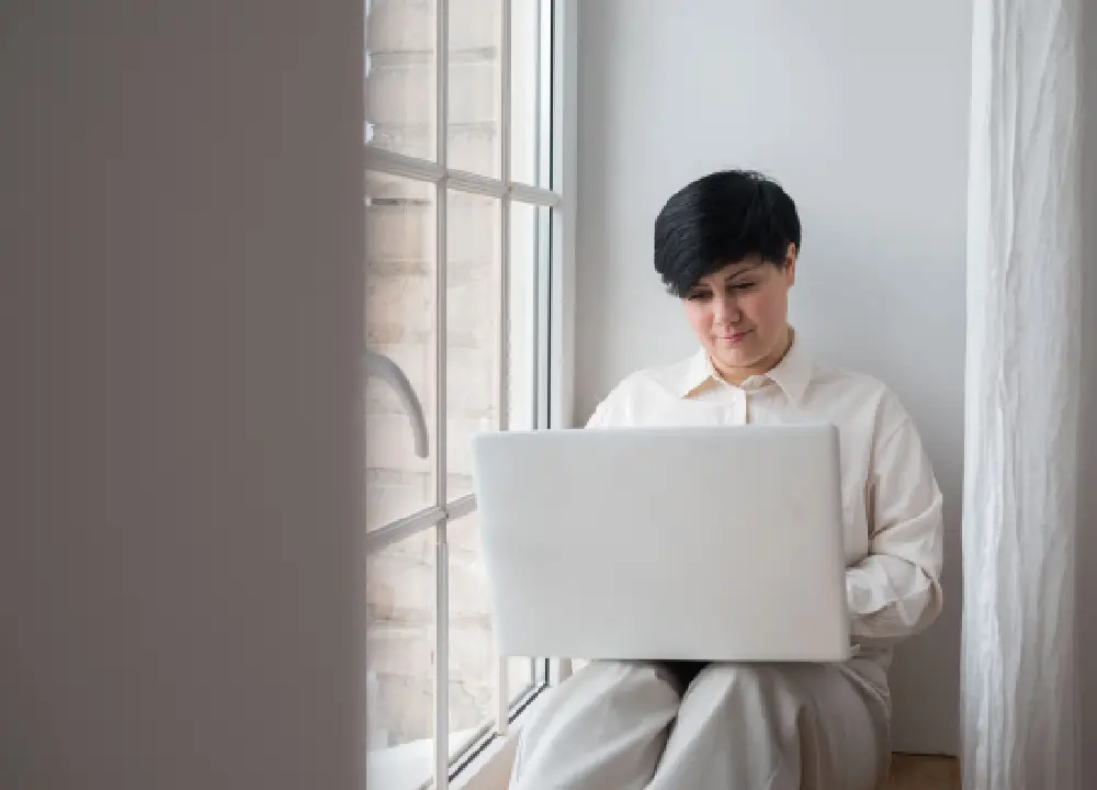 A person using a laptop to search for a doctor online.